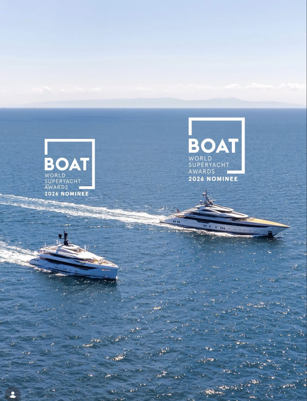 Two yachts cruising together at sea